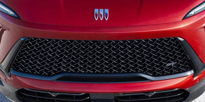 Buick Enclave Sport Touring conclusion section with grille close-up and SUV exterior styling.