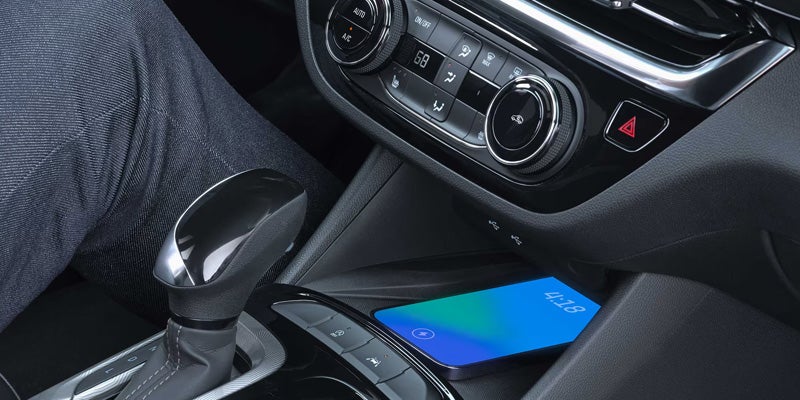 2026 Buick Envista center console featuring wireless charging and infotainment controls