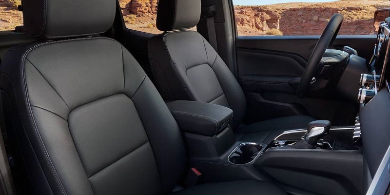 Interior of the 2026 GMC Canyon featuring premium front seats and modern cabin design